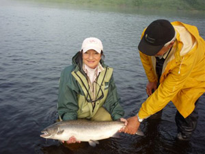 Ginette Carriere landed this beautiful salmon Thursday morning July 28 at the mouth of the Cains with a stone fly. Great fun!