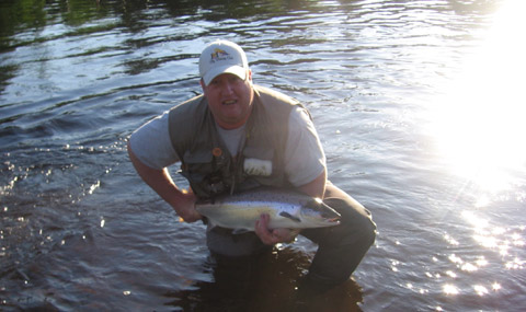 Ashley Hallihan sends this picture of a nice salmon that he hooked on the Main Southwest on June 11. The fish rolled agressively three times on a #6 lime green machine but was hooked on a #6 double butt shady lady.