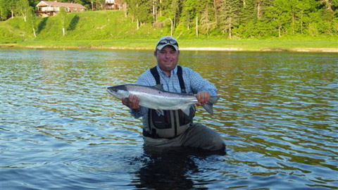 Derek Munn sends this photo of a salmon he hooked Monday evening on a #6 Shady Lady bug. It fought unreal, was jumping a lot and went into his backing three times.