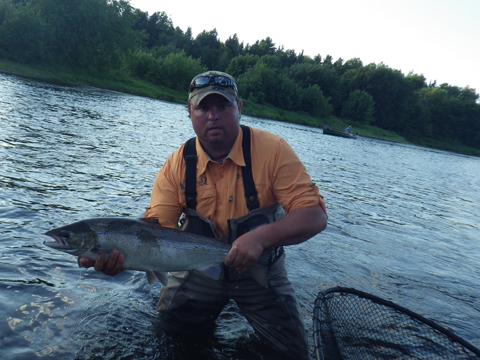 Guide Derek Munn with a 16lb hen caught by veteran fishermen Dr. Scott Boley on #6 Smurf Guide Derek Munn with a 16lb hen caught by veteran fishermen Dr. Scott Boley on #6 Smurf
