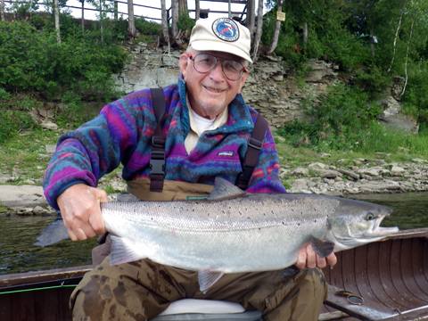 Dr. Scott Boley with one of many salmon he caught on a #6 Smurf in the last week.