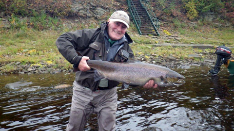 This is a picture of Bill Haldane with a 24lb salmon taken at Flo's pool on and African Mistake.