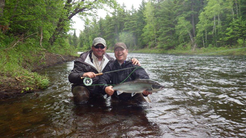 Derek Munn and Andrew with a nice salmon on a tributary of the main Souwest Miramichi