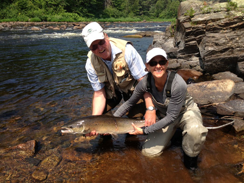 Ledges guest Anne Talbot-Kleeman with a beautiful salmon taken on a white and orange bomber. Tight lines!