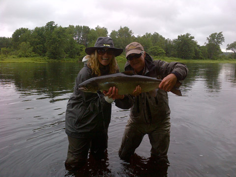 Sharon Needham and guide Lloyd Lyons with her first Atlantic salmon.